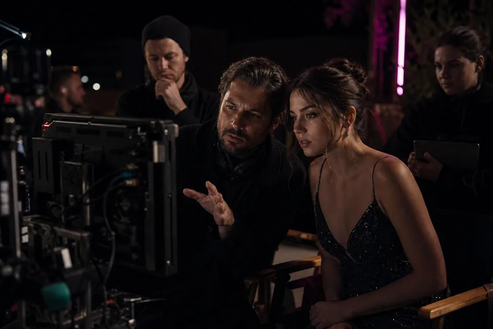 Film set with crew, cameras and a director chair